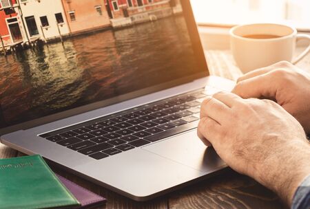 Man using laptop planning vacation. Travel and vacations concept の写真素材
