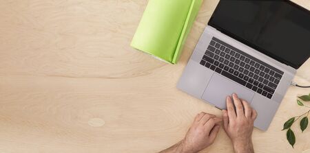 Online sports or yoga home training concept Laptop with yoga mat on the table top view