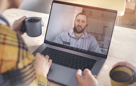 Man making video call using laptop Online learning, communication or brainstorm conceptの写真素材