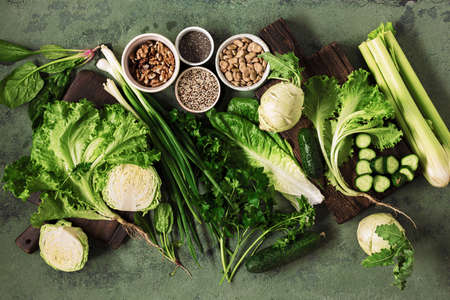 Health vegan food concept vegetables, nuts, seeds and cereals top view. Healthy green eatingの写真素材
