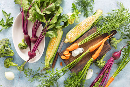 Raw ingredients for cooking vegetarian food on wooden table Healthy vegan meal top view