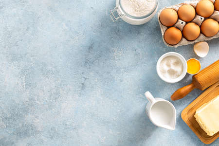 Raw ingredients for cooking pie Bakery background top view