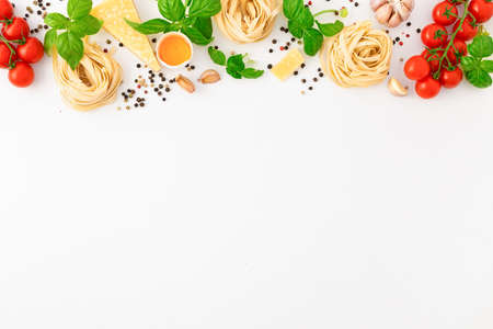 Iettuccine with ingredients for cooking Italian pasta on white background, top viewの写真素材