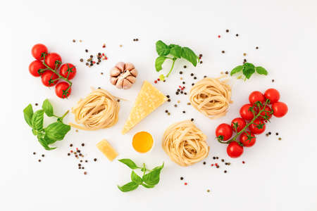 Fettuccine with ingredients for cooking pasta on white background, top view. flat layの写真素材