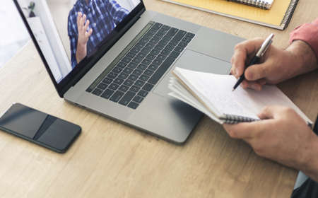 Online education concept. Male student studying online using laptopの写真素材