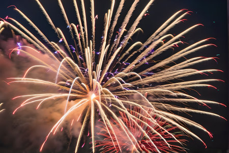 Colorful fireworks of various colors over night sky, celebration and anniversary conceptの素材