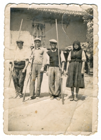 CIRCA 1930 - Villagers in front of house 