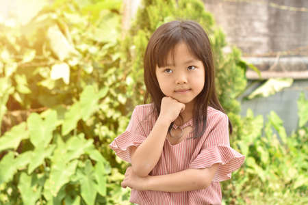 Portrait of little girl playing in the park on summer day.のeditorial素材
