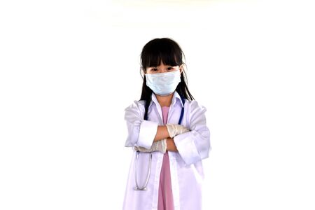 Girl in the gown examining disease, wearing gloves, wearing covid masks 2019の写真素材