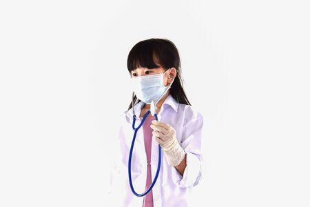 Girl in the gown examining disease, wearing gloves, wearing covid masks 2019の写真素材