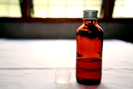 Transparent glass bottle of syrupの写真素材