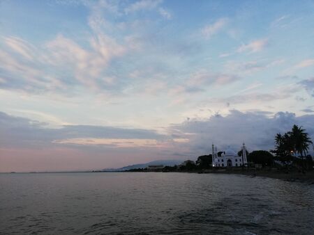 Blue sky on sunset at the beachの写真素材