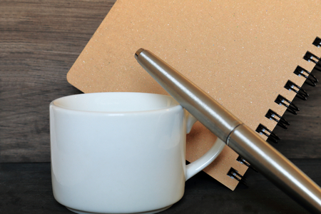 Coffee and notepad and writing tool.の写真素材