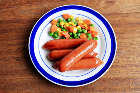 It is baked sausage and mixed vegetables.の写真素材