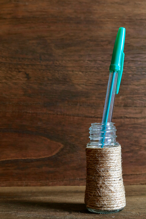 Hemp string and bottle. Winding the hemp cord to the bottle. self made.の写真素材