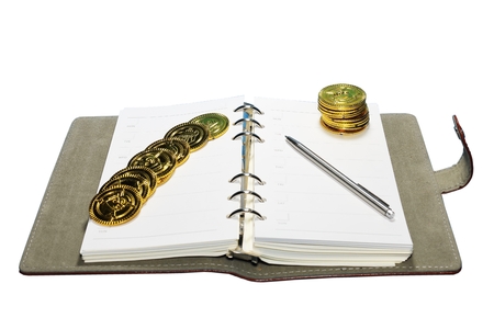 Toy coin and notebookの写真素材