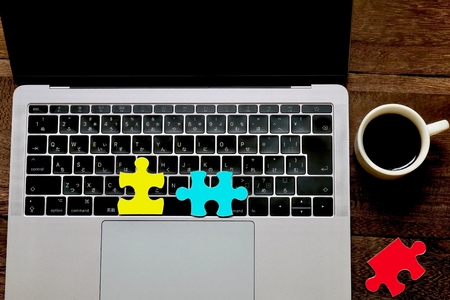 Laptops and puzzlesの写真素材