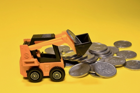 Excavator and coinの写真素材