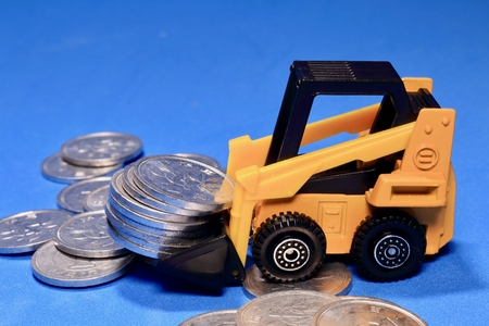 Excavator and coinの写真素材