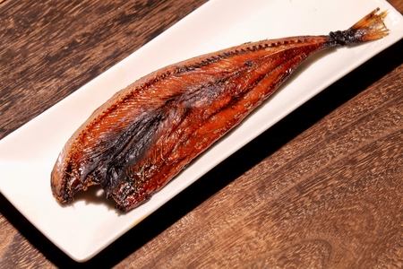 Fish on white plateの写真素材