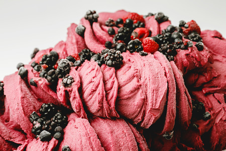 Berry ice cream in the metal tray on white background