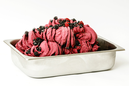 Berry ice cream in the metal tray on white backgroundの写真素材