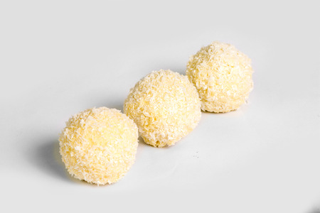 White chocolate truffles on white background