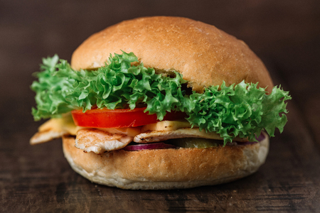 Chicken hamburger on wooden tableの写真素材