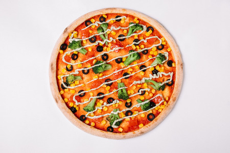Pizza with vegetables isolated on white. Vegetarian pizza. Top viewの写真素材
