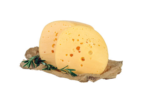 Cuted cheese head on wrapping paper with rosemary isolated on white backgroundの写真素材