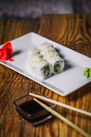 Sushi rolls on wood backgroundの写真素材