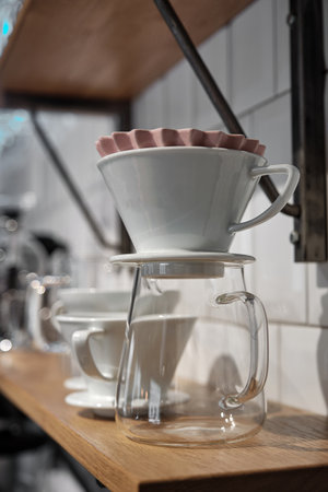 Equipment for alternative coffee brewing method, pour over, glass teapot, origami funnel on the...