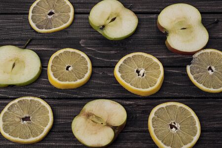 Apples slices on a wooden background top viewの写真素材