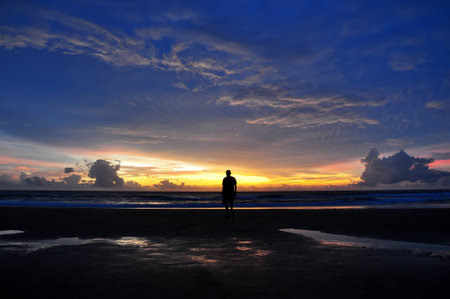Man on sunset beach tropical, Indian ocean