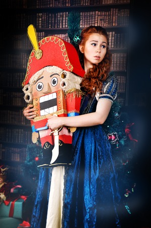 Beauty fashion woman who holding a nutcracker christmas