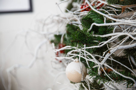 Christmas tree with toys and decorations in interior design in the roomの写真素材
