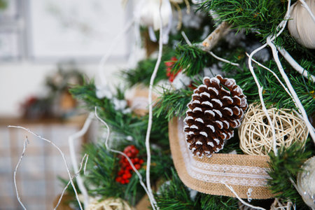 Christmas tree with toys and decorations in interior design in the roomの写真素材