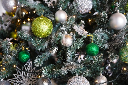 Christmas gifts under the Christmas tree with decorations in the morning, the interior in vintage styleの写真素材
