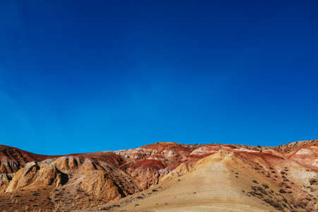 Mountain landscapes with beautiful views of red rocks and peaks in Altai in autumn