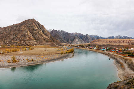 Mountain river surrounded by high rocks in Altai in autumnの写真素材
