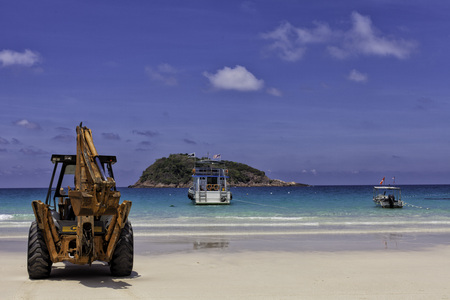 Beautiful beach at Redang Island with boat and bulldozer, Malaysiaのeditorial素材