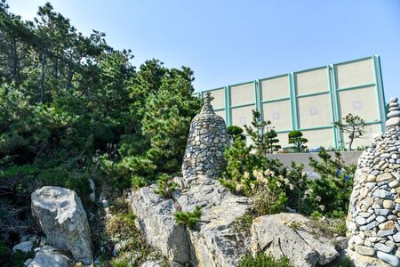 Stone towers piled up in Haedong Yonggung Temple.の写真素材
