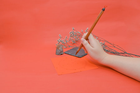 Writing chinese calligraphy with word meaning luck for lunar new yearの写真素材