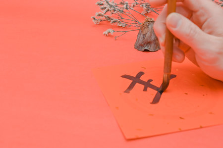 Writing chinese calligraphy with word meaning luck for lunar new yearの写真素材