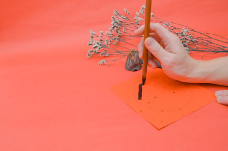 Writing chinese calligraphy with word meaning luck for lunar new year- The Chinese character FU (blessing) chun (spring) Chinese style calligraphy in lunar new yearの写真素材