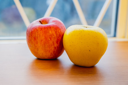 yellow and red apples on table close-up