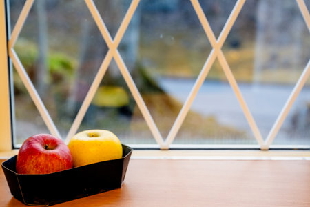 Japanese yellow and red apples on table close-upの写真素材