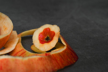There is no skin on the apple pulp, and the remaining apple skin is a hollow apple.with black...