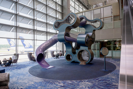Changi, Singapore - October 24, 2024: Tourists transiting at Singapore Changi Airport. It is one of the largest airports in the world, interior sceneの写真素材
