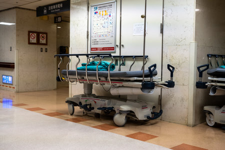 Beds in hospital waiting area. Empty hospital bed after patient leaves after recoveryの写真素材
